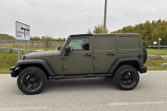 Jeep Wrangler mit Umbau und Raptor-Lackierug in Grün